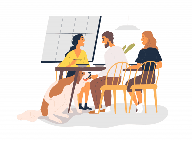 Friends at a table, feeding a dog under the table