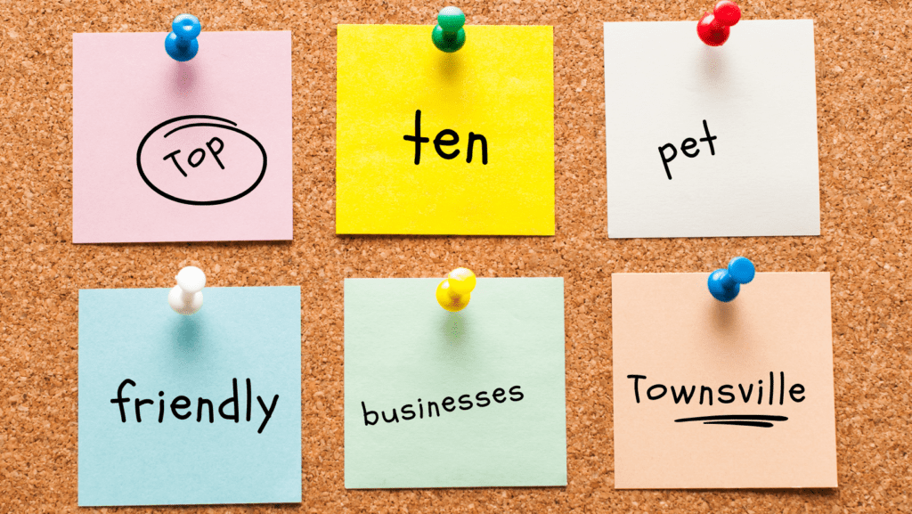 Pinboard with post its pinned that say top 10 pet friendly businesses Townsville
