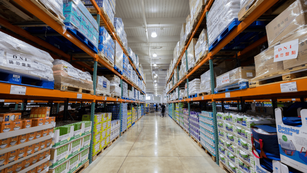 Shelves stocked with various brands of bulk-buy pet food bags, showcasing a variety of options for pet owners looking to purchase in larger quantities. A convenient and economical display of pet food choices.