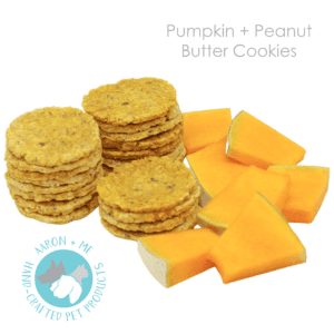 Delicious pumpkin pieces laid out next to pumpkin biscuits.