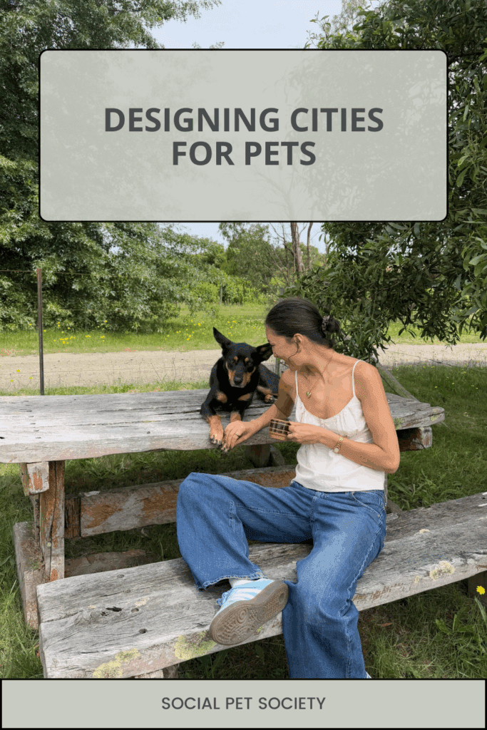 A woman sitting on a park bench enjoying a sunny day with her dog by her side.